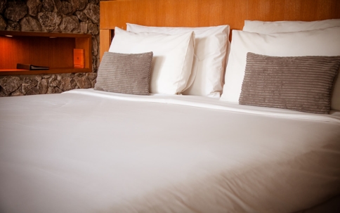 Bedding on a well-made bed is neat and tidy.